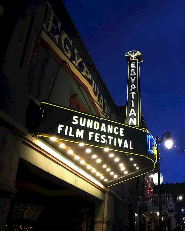 The image shows the Egyptian Theatre with a marquee reading 